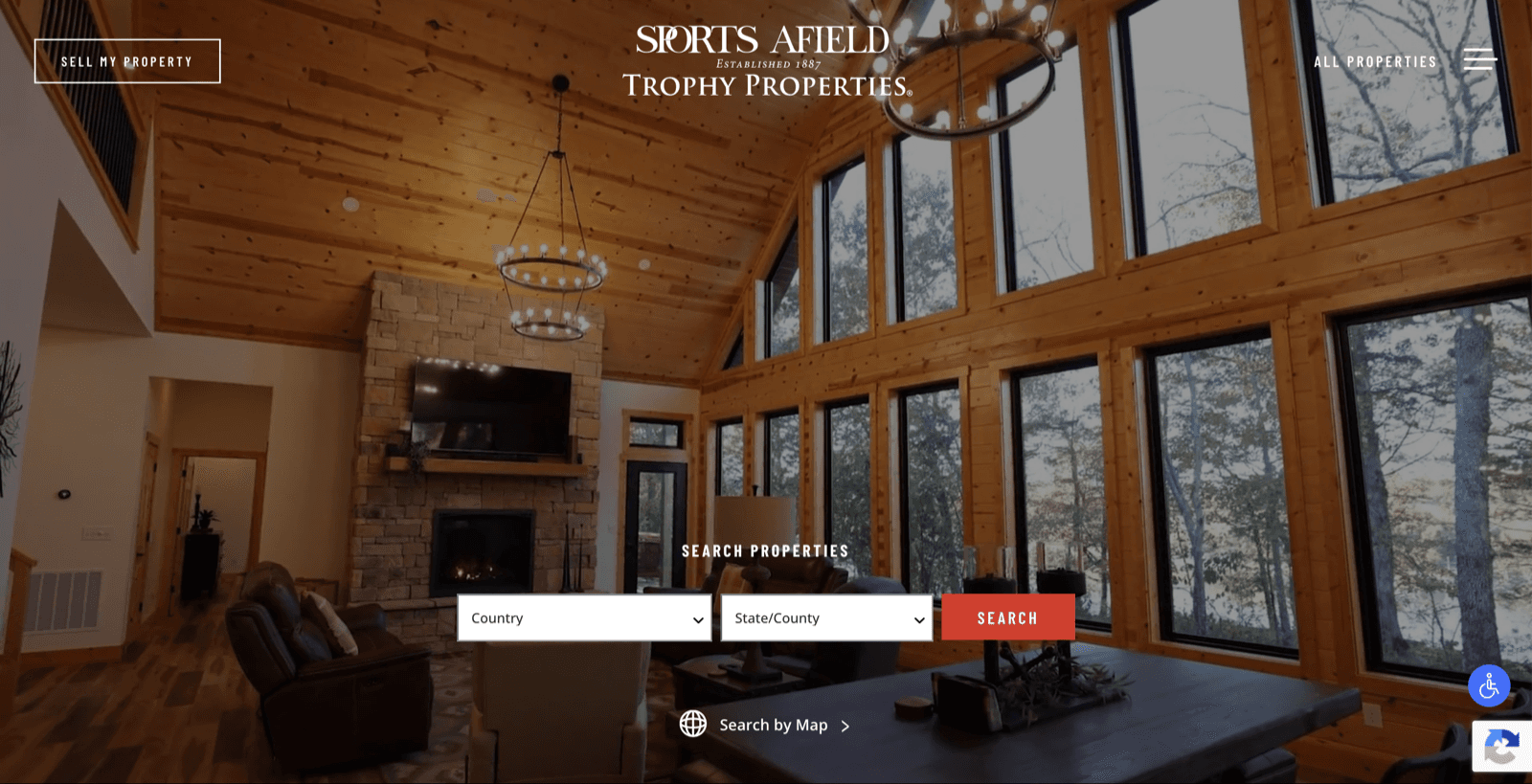 Sports Afield Trophy Properties homepage showing a luxury property interior and property search controls